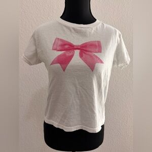 Gildan 100% Heavy Cotton “In Print We Trust” Baby Tee | Pink Bow Graphic